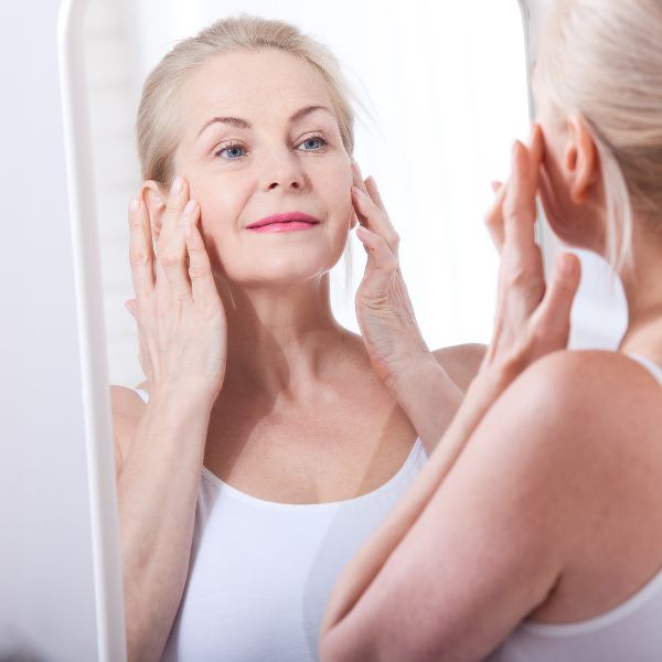 NuSkin RF MicroNeedling Absorption - image of woman touching her face